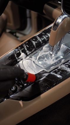 the interior of a car is clean and ready to be used by someone with gloves on