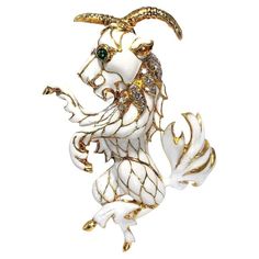 This highly articulated and very large Pan characterization brooch is finely crafted and covered over most of its surface with luxurious white cloisonne enamel. Bezel set are two emerald cabochon eyes, and seventeen brilliant cut diamonds grace the creature's regal mane. Total diamond weight is 1.15ct and overall quality is F/G-VS1. This example is very large, measuring 3 1/2 inches in length and 2 5/8 inches left to right. It is constructed to be secured to garments by a double hinged pin on the reverse side. This item is easily adaptable for wear as a pendant also and can be converted gratis at the buyer's request. The marking is 18k stamped discreetly on the rear and gross weight is 72.90 grams. Metal: 18k Weight: 72.9 grams Date of manufacture: Mid 20th century Ref: 220112/FA02axahh Modern Bangle, Emerald Cabochon, Gold Fox, David Webb, Mythical Creature, Wedding Brooch, Diamond Brooch, Bird Brooch, Cloisonne Enamel