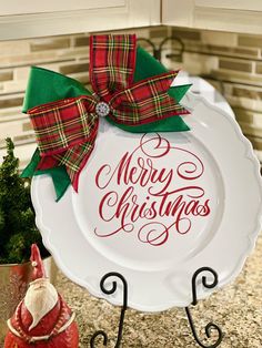 a merry christmas plate sitting on top of a counter