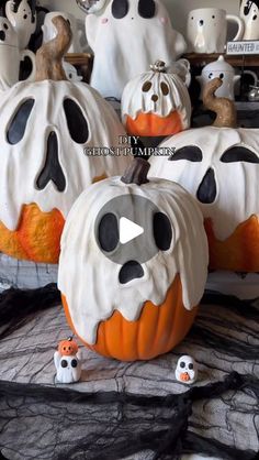 halloween pumpkins decorated with black and white decorations