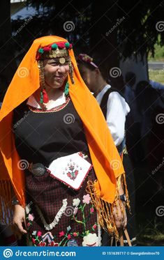 an old woman dressed in traditional clothing and headdress stock photo - image 3497