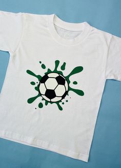 "football splat T-shirt, personlised football tshirt Available in white, pink and navy age from 1-2 up to 12-13 unisex fit t-shirt. All t-shirts have premium green vinyl splat with white and black football  For that extra personal touch why not add the child's name printed underneath the splat  ---------CARE INSTRUCTIONS-------- T- shirts are 100% ringspun cotton and can be washed on a max 40C wash, do not tumble dry and do not iron on the vinyl image. --------T-SHIRT QUALITY AND SIZING-------- T-shirts are 150gsm or higher some Colours may vary. They are a unisex fit 1/2 (26\") 3/4(28\") 5-6(30\") 7-8(32\") 9-11(34\") 12/13(36\"). --------HOW TO ORDER-------- 1. Select the colour t-shirt and size you would like from the drop down box's  2.please specify colour glitter vinyl-pink, gold ,pu Football Fan Gifts, Shirt Painting, Frozen Birthday Theme, Tshirt Painting, Soccer T Shirt, Green Vinyl, Fabric Paint Designs, Boys Pattern, T Shirt Painting