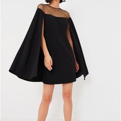 Be The Star Of The Show In The Black Estelle Dress. Full Of Effortless Elegance With A Cape-Like, Swingy A-Line Silhouette, This Darling Little Number Gets An Unexpected Yet Special Touch From The Sheer Mesh Upper That Allows You To Show Off Some Skin While Keeping It Subtle. Pair With Pumps And A Clutch For A Timeless Look That's Perfect For Party Time! Round Neckline Angled Cape Sleeves Sheer Mesh Upper Keyhole Back With Button Closure Back Zipper Swingy, A-Line Cape Silhouette Mini Length Lin Tuckernuck Dress, Estelle Dress, Jackie Dress, Daphne Dress, Minimalist Closet, Cotton Blends Dress, Cape Sleeves, Ruffle Long Sleeve, Dress Shirt Sleeves