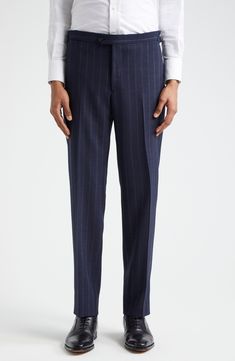 Pinstripes point up the precision tailoring of this structured suit cut from sumptuous wool in a single-breasted silhouette and framed with wide peaked lapels. Jacket has two-button closure; peaked lapels; four-button cuffs; chest welt pocket; front flap pockets; ticket pocket Trousers have zip fly with button-tab closure; front slant pockets; back button-welt pockets; adjustable waist Jacket is partially lined Trousers are unhemmed 100% wool Dry clean Made in Italy Designer Clothing Tailored Vertical Stripe Business Pants, Tailored Vertical Stripe Pants For Business, Business Tailored Vertical Stripes Pants, Formal Tailored Pants With Vertical Stripes, Classic Striped Formal Bottoms, Classic Striped Business Pants, Classic Striped Pants For Formal Occasions, Tailored Vertical Stripe Formal Bottoms, Tailored Bottoms With Vertical Stripes For Formal Occasions