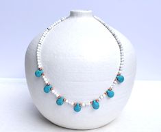 This lovely beaded necklace consists of mini natural howlite stones (white) that have been embellished with turquoise howlite teardrop beads, and rose gold accents. So pretty, so feminine, and can also come with silver or gold accents if preferred.  MATERIALS: ▪️ Natural Howlite 4mm beads ▪️ Howlite (blue) teardrop beads ▪️ Accents - choice between gold plated, rose gold plated, or silver plated beading DIMENSION: Necklace Length - 45cm *Please contact me if you require a different length Howlite Gemstone Beads Necklace, Adjustable Howlite Gemstone Bead Necklace, White Turquoise Gemstone Beads Necklace For Gifts, White Turquoise Necklace With Gemstone Beads For Gifts, White Turquoise Necklace With Gemstone Beads As Gift, Beaded Howlite Necklaces With Round Beads, White Natural Stone Necklace For Gift, Howlite Beaded Necklaces With Round Beads For Gifts, Howlite Beaded Necklaces With Round Beads As Gift