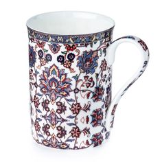 an ornately decorated coffee cup on a white background