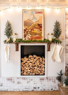 a fire place with stockings hanging on the mantle