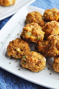 sausage balls on a white plate with parsley