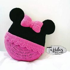 a crocheted minnie mouse purse with a bow on it's head is shown