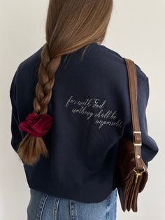 This is a professionally embroidered sweatshirt. 👚MATERIAL  80% cotton 20% polyester ▪️ SIZE  Sizes are unisex. Please check the size chart before you purchase.  💧 CARE:  Machine wash cold, inside-out, gentle cycle with mild detergent and similar colors.   Tumble dry low, or air-dry for longest life. Every item is made to order, creating less fabric waste than conventional manufacturing. Please note that the embroidery comes with a backing that acts as a stabilizer to support the fabric and st Navy Long Sleeve Sweatshirt With Embroidered Logo, Navy Cotton Sweatshirt With Embroidered Logo, Fleece Sweatshirt With Embroidered Text For Streetwear, Streetwear Fleece Sweatshirt With Embroidered Text, Embroidered Long Sleeve College Sweater, Embroidered Long Sleeve Sweater For College, Navy Cotton Sweater With Embroidered Logo, Crew Neck Sweater With Embroidered Text For College, Fall College Sweatshirt With Embroidered Text