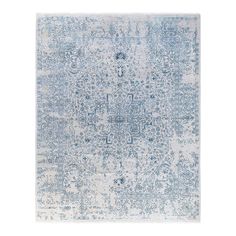 a blue and white rug with an intricate design