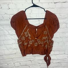 Nwt Free People Embroidered Rust Colored Crop Top Small Festive Floral Embroidered V-neck Top, Fitted Resham Embroidery Crop Top, Traditional Brown Festive Tops, Festive Brown Traditional Tops, Festive Traditional Brown Tops, Brown Embroidered Festival Top, Embroidered Brown Tops For Festival, Fitted Embroidered Tops For Festive Season, Festive Embroidered Fitted Tops