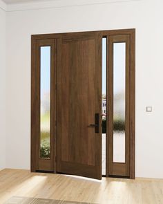 an empty room with two wooden doors and one glass door is open to the outside