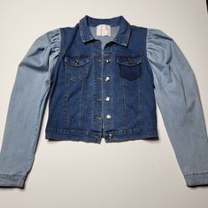 Women's Two-Tone Bubble Shoulder Denim Jean Jacket Coat Color: Blue Denim Size M 78% Cotton, 21% Polyester, 1% Spandex New Without Tags Excellent Pre-Owned Condition Blue Stretch Denim Jacket With Long Sleeves, Stretch Medium Wash Long Sleeve Outerwear, Medium Wash Stretch Denim Jacket With Long Sleeves, Stretch Medium Wash Winter Outerwear, Stretch Medium Wash Outerwear For Winter, Fall Denim Blue Stretch Outerwear, Fall Stretch Denim Blue Outerwear, Stretch Denim Long Sleeve Outerwear, Trendy Stretch Denim Jacket With Long Sleeves