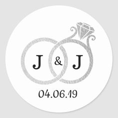 wedding stickers with two rings and diamond on the middle, in grey ink that says j & j