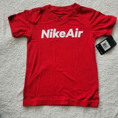 Nike Young Boy T-Shirt Nwt Boy Sz 6 Color: University Red/White Red Nike T-shirt For Summer, Nike Red Graphic Tee, Nike Red T-shirt For Summer, Nike Red Graphic Tee Top, Red Short Sleeve Shirt With Logo Print, Basic Red T-shirt With Logo Print, Spring Red T-shirt With Logo Print, Tops Nike, Nike Red