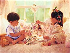 two children are sitting on the bed eating tea and playing with toy cars in front of them