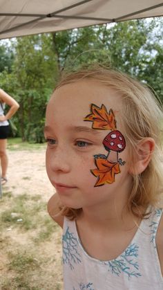 Mushroom face paint Fall Cheek Face Painting, Woodland Face Paint, Face Painting Ideas For Fall Festival, Fall Fest Face Painting, Face Paint Signage, Easy Fall Festival Face Painting Ideas, Face Painting Mushroom