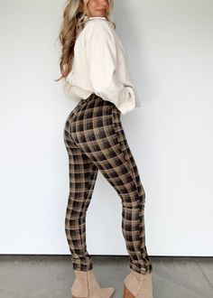 Experience the perfect combination of sophistication and style with our Tartan Tempo Pants. Featuring a plaid pattern and a stretchy elastic waistband, these high waisted pants will keep you looking sharp and feeling comfortable all season long--perfect for dinner, drinks, and even Christmas parties! Soft, stretchy knit fabric allows for a chic, elevated look that's both professional and cozy. Enjoy a touch of elegance with Tartan Tempo Pants. Fabric 95% Polyester 5% Spandex Machine wash cold. Dinner Drinks, Pants Fabric, Christmas Parties, Plaid Pattern, High Waisted Pants, Dresses Xs, Christmas Party, Tartan, Knit Fabric