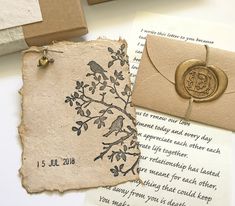 an envelope with a wax stamp on it next to some cards and other items that include stamps