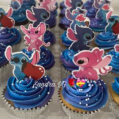 cupcakes with cartoon characters on them are displayed