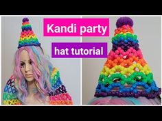 a wig and hat made out of rainbow colored yarn