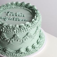 there is a green cake with frosting on the top that says teal together