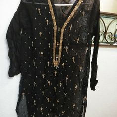 Cotton Net Shirt With Slip Traditional Black V-neck Blouse, Fitted Black Kurta For Party, Elegant Black Tops For Festive Occasion, Elegant Black Festive Tops, Black Dabka Work Party Dress, Elegant Black Embellished Kurta, Black Party Dress With Dabka Work, Elegant Black Festive Blouse, Festive Black V-neck Top