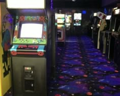 a video game machine sitting in the middle of a room filled with arcade machines and games