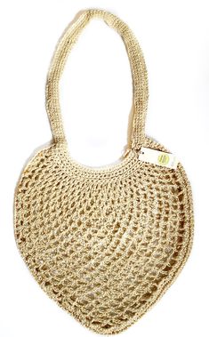 a crocheted bag is shown on a white background with a tag in the middle