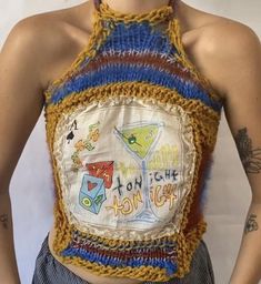 a woman wearing an apron made out of crochet