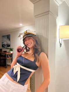 a woman in a sailor outfit posing for the camera