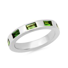 We just love a pop of green, and the 14K Gold Stationary Tsavorite Baguette Ring adds that hint of color your wardrobe has been asking for. Featuring gorgeous Tsavorite baguettes set into a shiny gold band, this ring stacks with others and looks beautiful on its own - you really can't go wrong!Pair our Stationary Tsavorite Baguette Ring with our Tsavorite Domed Ring. 0.99 carats SBR59-YG-TSAV All sales are final. Luxury Green Emerald Stackable Ring, Green Baguette Cut Stackable Rings, Green Emerald Stackable Ring With Baguette Cut, Green Baguette Cut Stackable Emerald Ring, Luxury Green Channel Set Rings, Modern Green Stackable Rings, Modern Green Emerald Ring For Anniversary, Green Emerald Ring With Channel Set As A Gift, Modern Green Emerald Ring With Polished Finish