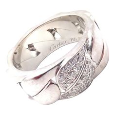 About This Piece:  Metal: 18k White Gold  Size: European 53, US 6  Weight: 15.7 grams  Stones: 22x round brilliant cut diamonds VS1 clarity, G color total weight approx. .50ct  Hallmarks: Cartier 750 53 (Serial Omitted)   Please refer to the dimensions in the description above for accurate measurements. Please reach out to the seller with any questions on dimensions or fit prior to purchase. Cartier White Jewelry With Pave Setting, Classic Cartier Diamond Ring With Pave Setting, Cartier Platinum Diamond Ring With Diamond Accents, White Cartier Diamond Ring With Accents, Cartier Diamond Ring Brilliant Cut, Luxury Cartier Diamond Ring With Vvs Clarity, Cartier White Diamond Ring With Accents, Luxury Cartier White Gold Diamond Ring, Cartier Platinum Diamond Ring Round Cut