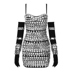 a black and white dress with lots of beads on the shoulders, long sleeves and cuffs