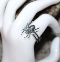 Elevate your Halloween look with our exquisite Spider Halloween Ring. Crafted with intricate detail and luxurious materials, this stunning piece is sure to add a touch of sophistication to any spooky ensemble. Metal :-  Silver Style : Insect Your order will be handmade and ready for shipment in 1 to 3 business days https://www.etsy.com/shop/RivikaDesigns Handmade Magical Jewelry For Halloween, Fantasy Rings For Halloween Gift, Unique Metal Rings For Halloween, Unique Silver Rings For Halloween, Elegant Rings As Halloween Gifts, Unique Collectible Halloween Jewelry, Elegant Rings For Halloween Gifts, Elegant Halloween Gift Ring, Silver Rings As Halloween Gift