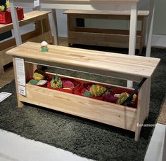 a wooden bench sitting on top of a carpet covered floor