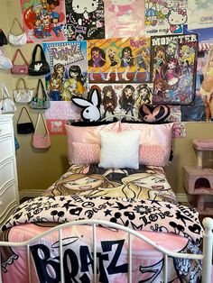 a bed room with a neatly made bed and lots of pictures on the wall above it