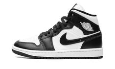 The Women’s Air Jordan 1 Mid “Panda” is a women’s-exclusive colorway of the lifestyle shoe with a versatile look.  The ever popular “Panda” theme lands on the Jordan 1 Mid and, like the Jordan 1’s high and low-top styles that are also offered in the colorway, the results are quite favorable.  The shoe has a white leather upper with black leather overlays and a black leather Swoosh.  A white “Wings” logo appears on the collar and white Jumpman and “Air” detailing are found on the tongue tag.  Und Womens Air Jordan 1, Womens Air Jordan, 70s Converse, Panda Shoes, Nike X Travis Scott, Converse Run Star Hike, Low Air Jordan 1, Converse Run Star, Adidas Spezial