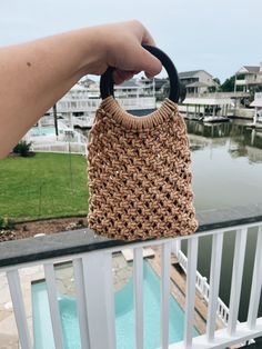 This is a unique, handmade macrame handbag/clutch. This bag will complement and add flair to any summer outfit.The hand bag is made with high quality 100% natural cotton single strand rope (3 mm size). It is made with natural wood handles. The bag measurements are:Height with handles - 10 inches Height without handles - 7 inchesLength - 7 inchesHandles measure 4 inch circumference Please let me know if you would like this design in a different color or size, and I would be happy to discuss doing Eco-friendly Macrame Straw Bag For Summer, Natural Macrame Beach Bag For Everyday Use, Natural Straw Bag With Macrame For Everyday Use, Eco-friendly Macrame Straw Bag, Natural Macrame Beach Bag For Summer, Natural Macrame Beach Bag For Vacation, Summer Macrame Beach Bag In Natural Color, Eco-friendly Natural Macrame Beach Bag, Summer Macrame Jute Straw Bag