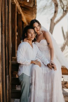 a bride and groom hugging each other on their wedding day