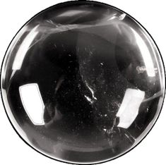 a black and white photo of a round object