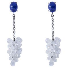 Alex Jona design collection, hand crafted in Italy, beautiful Clusters of natural cabochon Moonstone drops weighing 22 carats, dangling from two oval cabochon Tanzanites weighing 3.59 carats in total, mounted in 18k white gold. Length 1.7in.-43mm, Width 0.39in.-10mm. Posts with friction backs for pierced ears. Alex Jona jewels stand out, not only for their special design and for the excellent quality of the gemstones, but also for the careful attention given to details during all the manufacturi Luxury Drop Multi-stone Jewelry, Luxury Teardrop Cabochon Jewelry, Formal Multi-stone Drop Jewelry, Fine Jewelry With Cabochon Drop, Fine Jewelry Drop Cabochon, Elegant Drop Gemstone, Elegant Sapphire Gemstones For Jewelry Making, Elegant Multi-stone Drop Gemstones, Formal Jewelry With Oval Cabochon Natural Stones