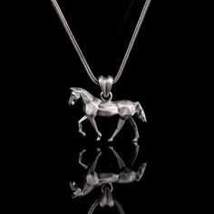 ★Introducing the stunning Silver Necklace Pendant, a true masterpiece of jewelry craftsmanship. This elegant necklace combines the timeless appeal of silver with the charm of a pendant, making it the perfect accessory for any occasion. Crafted from high-quality silver, this necklace radiates sophistication and durability. The pendant itself exhibits a captivating design, blending the grace of a horse with the intricate patterns of geometric origami. Each angle and curve is meticulously crafted, Modern Sterling Silver Necklace With Diamond Cut, Sterling Silver Square Pendant Necklace, Sterling Silver Square Pendant Necklace With Diamond Cut, Sterling Silver Diamond Cut Square Pendant Necklace, Faceted Silver Necklace For Gift, Sterling Silver Faceted Square Pendant Jewelry, Faceted Sterling Silver Square Pendant Jewelry, Faceted Sterling Silver Necklace, Fine Jewelry Sterling Silver Faceted Necklace