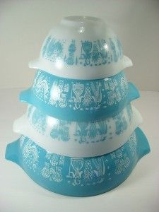 three blue and white dishes stacked on top of each other