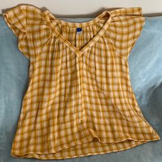 Yellow Plaid Old Navy Blouse Size L. V- Neck. Flutter Sleeve. New With Tags Mustard Short Sleeve Tops For Fall, Yellow Short Sleeve Blouse For Vacation, Casual Flutter Sleeve Blouse For Daywear, Casual Blouse With Flutter Sleeves For Daywear, Yellow Short Sleeve Blouse For Fall, Casual Mustard Tops For Vacation, Yellow Cotton Blouse For Fall, Fall Yellow Cotton Blouse, Mustard Short Sleeve Blouse For Spring