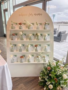 there are flowers and donuts on display in the store's window sill