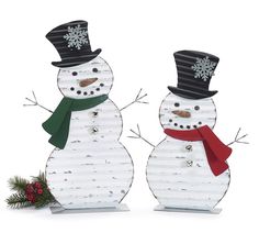 two snowmen are standing next to each other