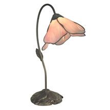 a lamp that is sitting on top of a table with a flower in the middle