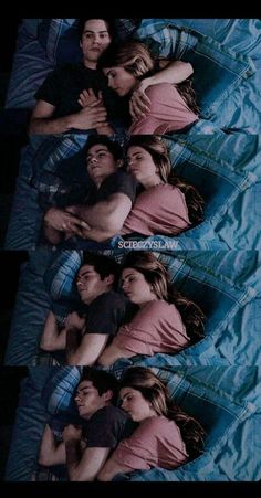 two people laying in bed with their arms around each other